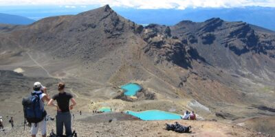 Shuttle service for the Tongariro Alpine Crossing hike, with a scenic mountain backdrop in Tongariro National Park.