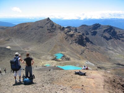 Shuttle service for the Tongariro Alpine Crossing hike, with a scenic mountain backdrop in Tongariro National Park.