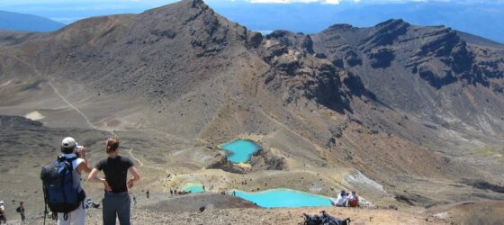 Shuttle service for the Tongariro Alpine Crossing hike, with a scenic mountain backdrop in Tongariro National Park.